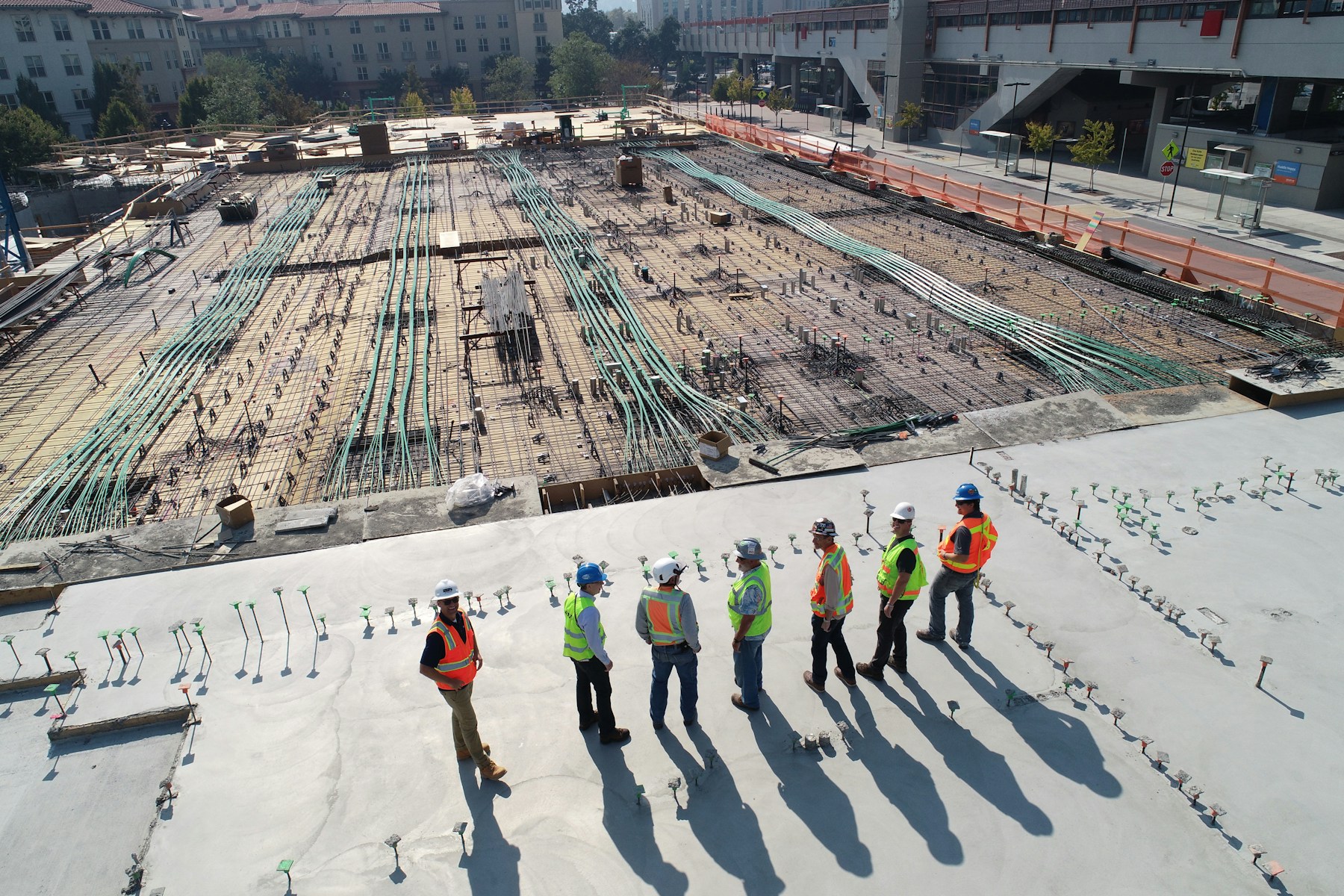 Illustrative stock photo of concrete foundation preparation with a construction crew